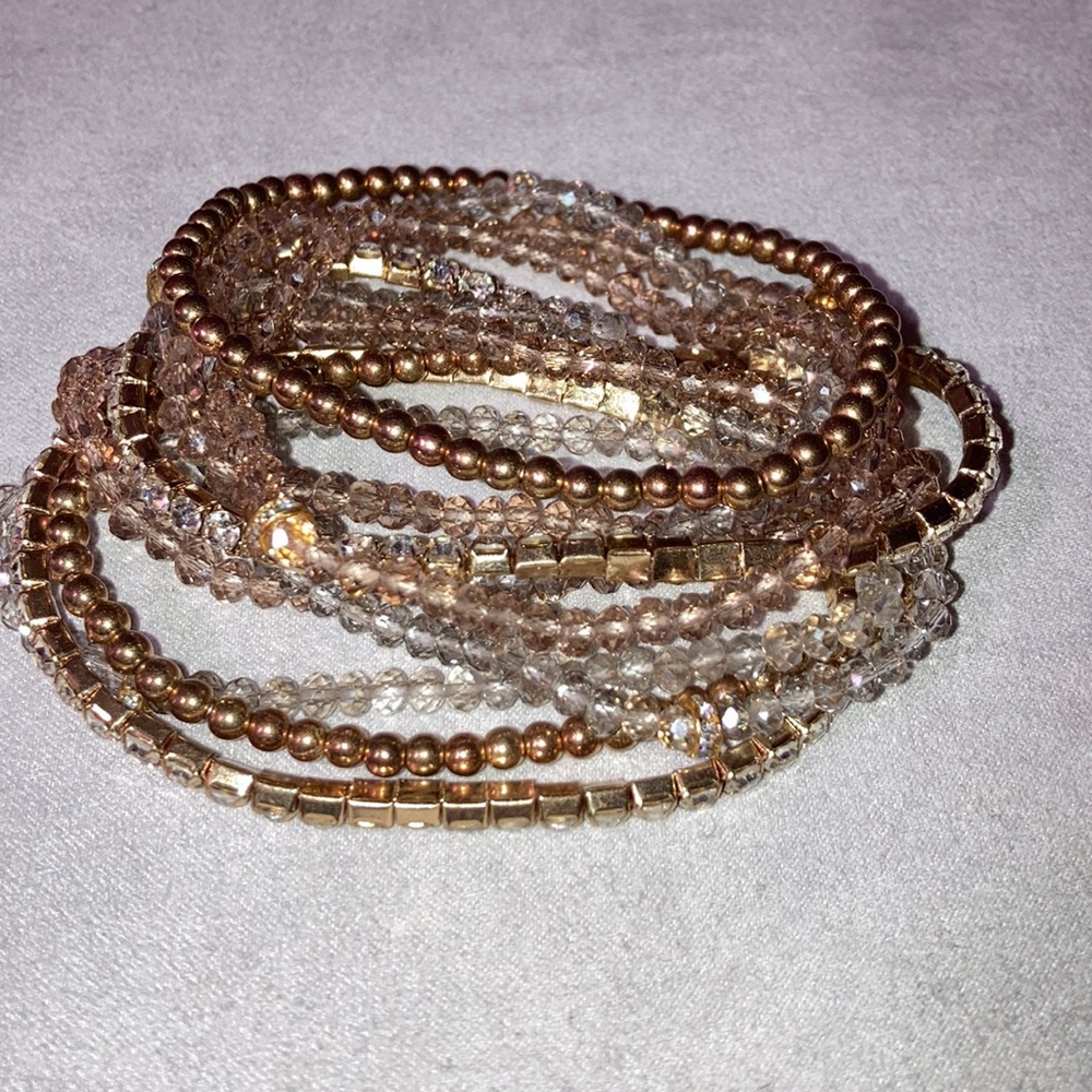 Gold color bracelets.